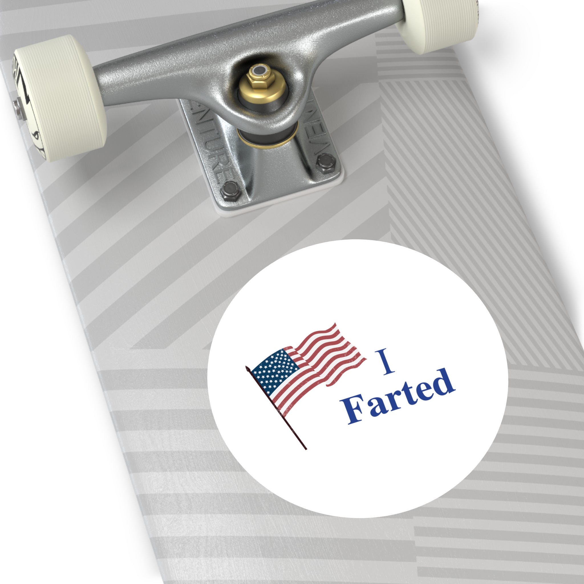 Skateboard with a sticker featuring an American flag and 'I Farted' text on a white background